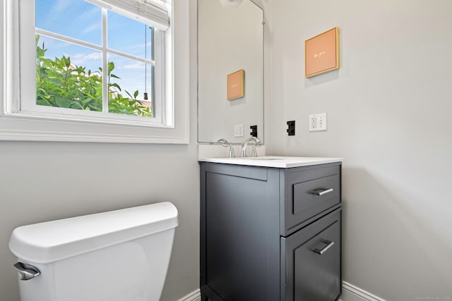 55 Perry Ln, Stratford, CT 06614 - half bath featuring toilet, vanity, and baseboards