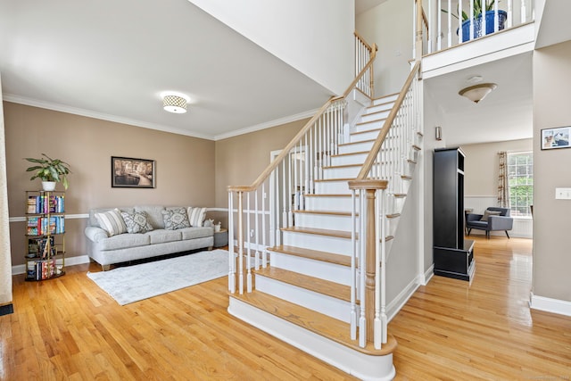 55 Perry Ln, Stratford, CT 06614 - stairway featuring wood finished floors, ornamental molding, and baseboards