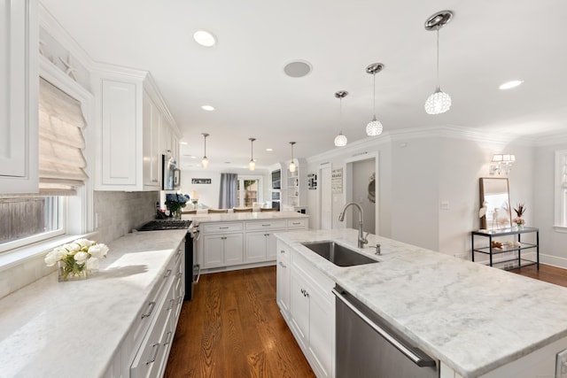 334 W Ave, Darien, CT 06820 - kitchen featuring a sink, stainless steel appliances, an island with sink, dark wood-style floors, and recessed lighting