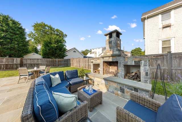 334 W Ave, Darien, CT 06820 - fenced backyard with a patio area, an outdoor living space with a fireplace, and outdoor dining area