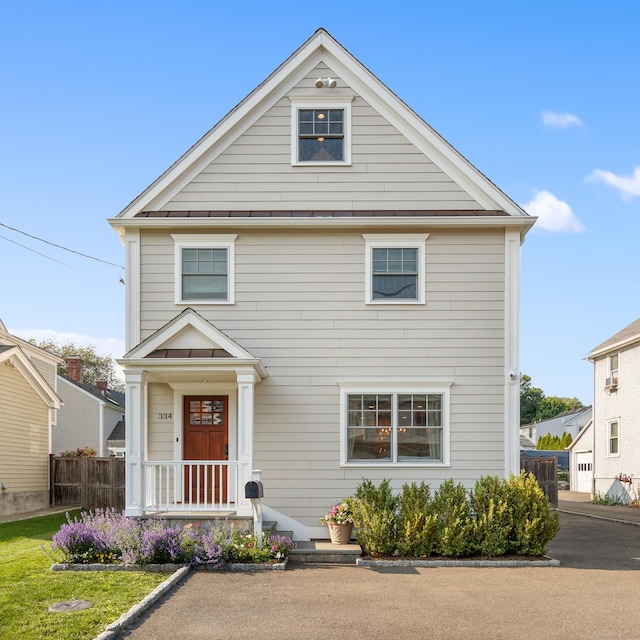 334 W Ave, Darien, CT 06820 - view of front of home featuring a standing seam roof and metal roof