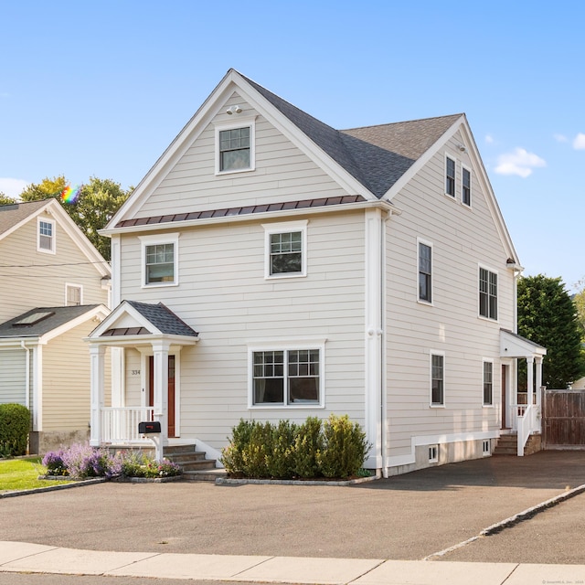 334 W Ave, Darien, CT 06820 - view of front of house featuring a standing seam roof and metal roof