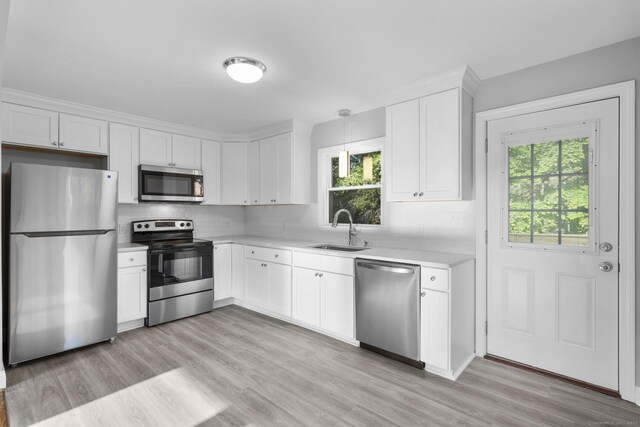 37 View St, East Haven, CT 06512 - kitchen featuring appliances with stainless steel finishes, a sink, light countertops, and decorative backsplash