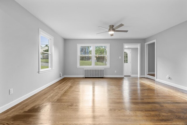 37 View St, East Haven, CT 06512 - unfurnished room with radiator, ceiling fan, wood finished floors, and baseboards