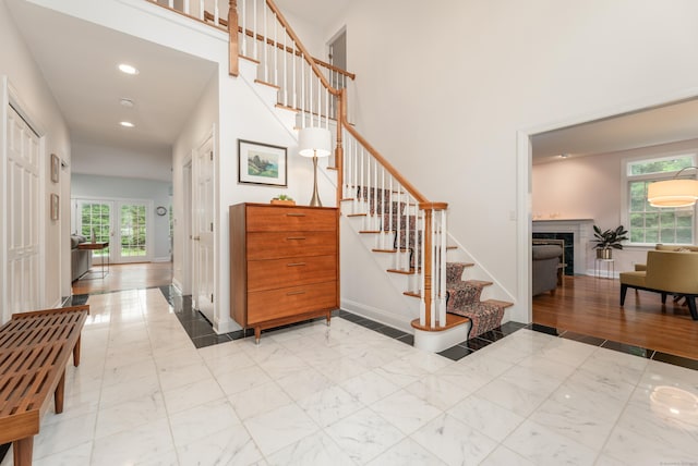 3 Mountaincrest Dr, Cheshire, CT 06410 - stairs with a fireplace, recessed lighting, baseboards, a towering ceiling, and marble finish floors
