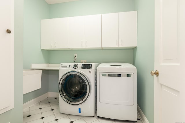3 Mountaincrest Dr, Cheshire, CT 06410 - laundry area with cabinet space, washer and clothes dryer, and baseboards