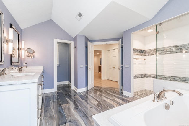 3 Mountaincrest Dr, Cheshire, CT 06410 - full bath with a garden tub, double vanity, vaulted ceiling, tiled shower, and baseboards