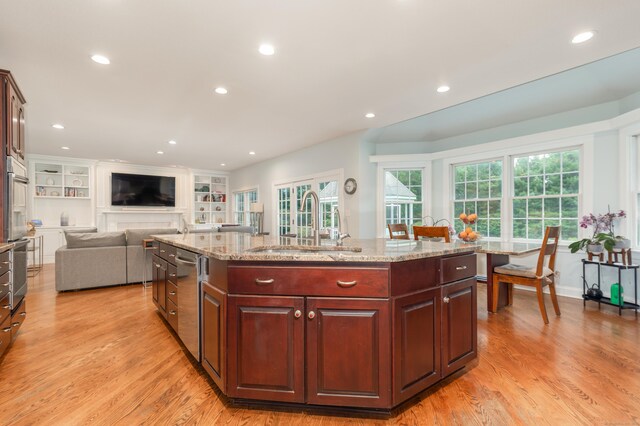 3 Mountaincrest Dr, Cheshire, CT 06410 - kitchen with a sink, light wood-type flooring, a center island with sink, appliances with stainless steel finishes, and light stone countertops