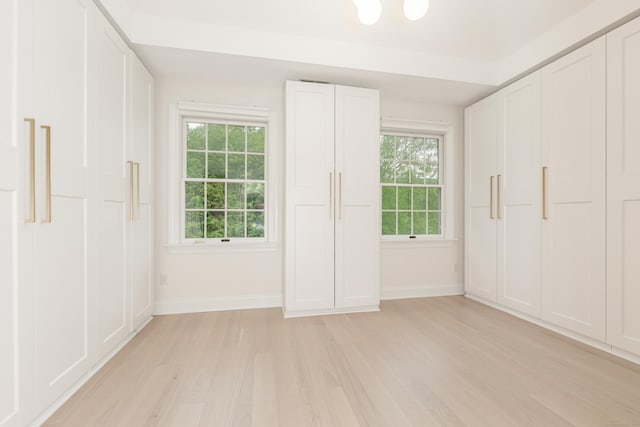 3 Mountaincrest Dr, Cheshire, CT 06410 - unfurnished bedroom featuring light wood-style floors, baseboards, and multiple windows