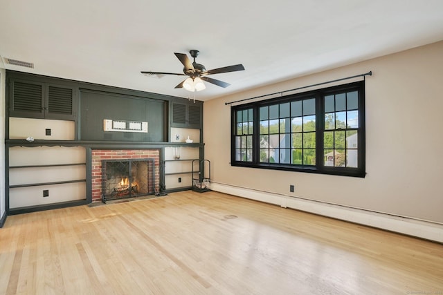 86 Rice Rd, Meriden, CT 06450 - unfurnished living room featuring light wood-style flooring, a brick fireplace, a ceiling fan, baseboard heating, and baseboards
