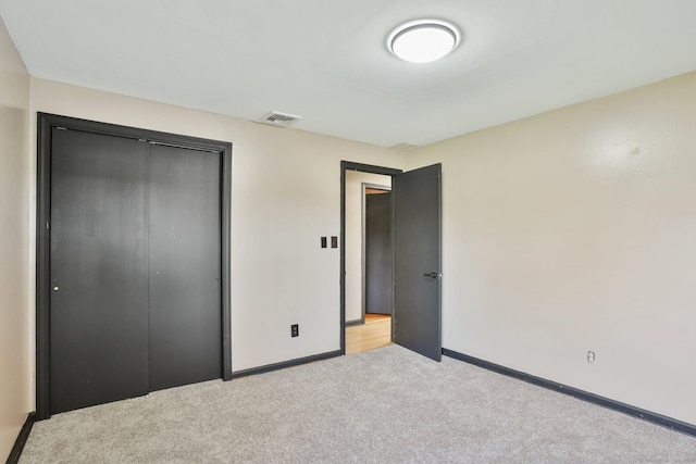 86 Rice Rd, Meriden, CT 06450 - unfurnished bedroom featuring light colored carpet, baseboards, and a closet