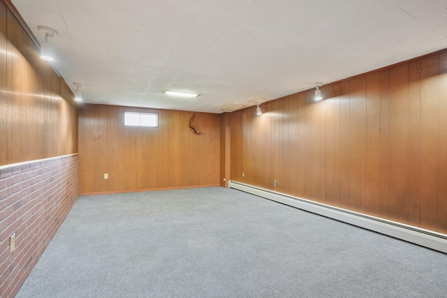 86 Rice Rd, Meriden, CT 06450 - below grade area with a baseboard heating unit, carpet flooring, wooden walls, and brick wall