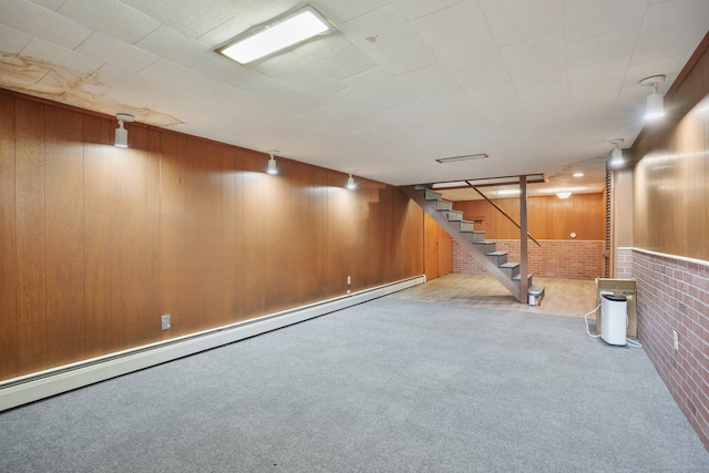 86 Rice Rd, Meriden, CT 06450 - finished basement featuring carpet, brick wall, a baseboard heating unit, wood walls, and stairway