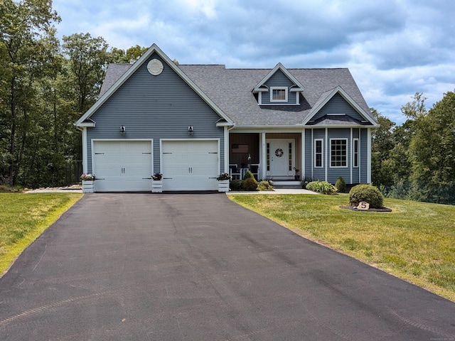 5 Newberry St, Haddam, CT 06441 - view of front facade with a garage, roof with shingles, a front yard, and driveway