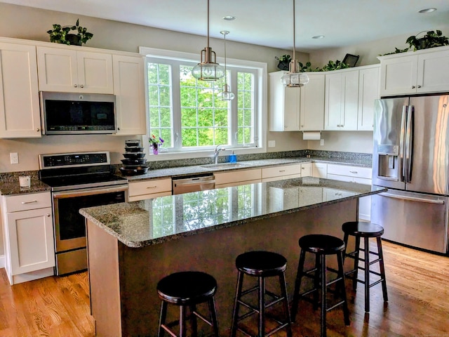 5 Newberry St, Haddam, CT 06441 - kitchen featuring appliances with stainless steel finishes, a sink, a center island, white cabinetry, and recessed lighting