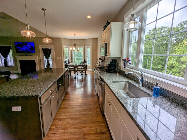 5 Newberry St, Haddam, CT 06441 - kitchen featuring a sink, appliances with stainless steel finishes, wood finished floors, a kitchen island, and hanging light fixtures