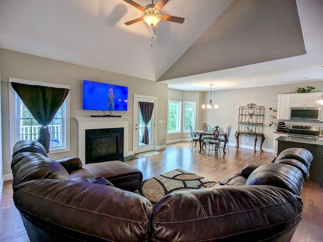 5 Newberry St, Haddam, CT 06441 - living area featuring wood finished floors, baseboards, a chandelier, ceiling fan, and high vaulted ceiling