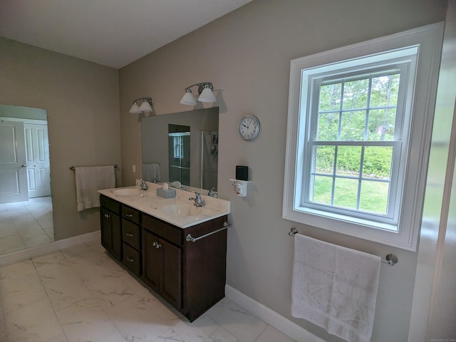5 Newberry St, Haddam, CT 06441 - bathroom with double vanity, marble look tiles, baseboards, and a stall shower