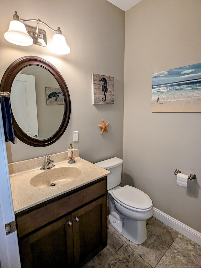 5 Newberry St, Haddam, CT 06441 - half bath with vanity, toilet, and baseboards