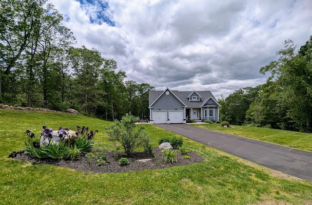 5 Newberry St, Haddam, CT 06441 - view of front of house with asphalt driveway, a front yard, and a garage