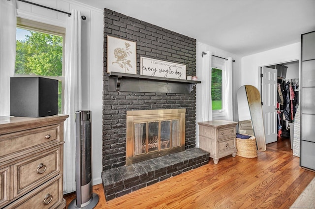 75 Carll Rd, Middletown, CT 06457 - living room featuring plenty of natural light, a fireplace, and wood finished floors
