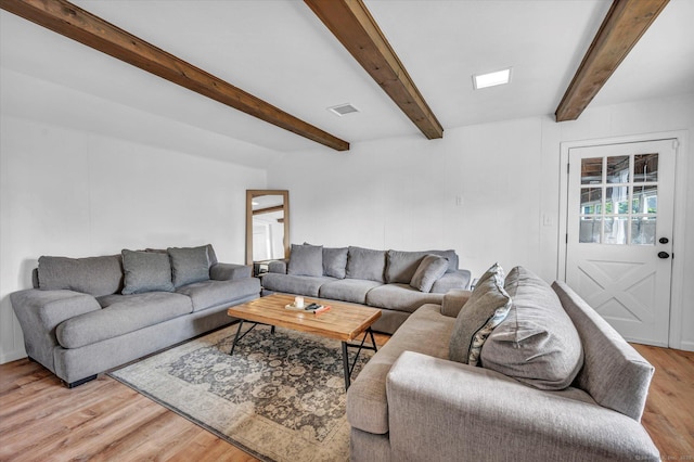 75 Carll Rd, Middletown, CT 06457 - living room featuring light wood finished floors and beamed ceiling