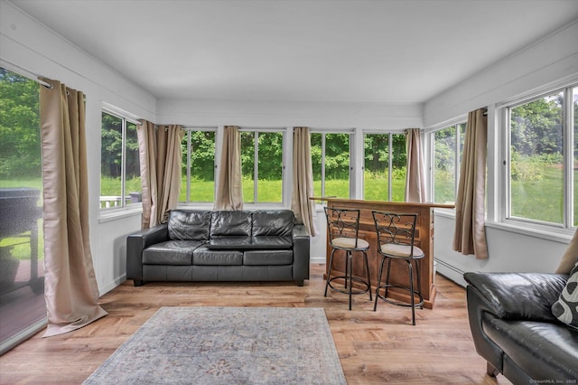 75 Carll Rd, Middletown, CT 06457 - sunroom with healthy amount of natural light, a baseboard radiator, wood finished floors, and a deck