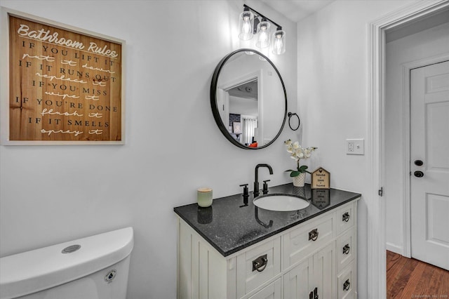 75 Carll Rd, Middletown, CT 06457 - bathroom with vanity, toilet, and wood finished floors