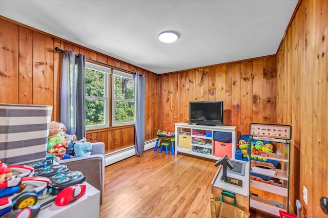 75 Carll Rd, Middletown, CT 06457 - playroom with a baseboard radiator, light wood-type flooring, and wooden walls