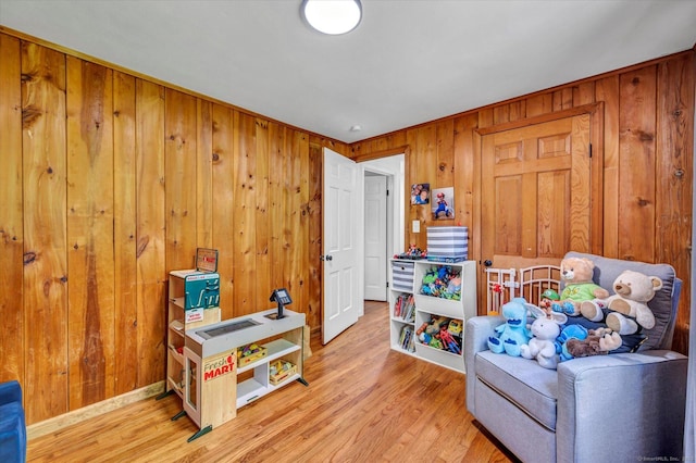 75 Carll Rd, Middletown, CT 06457 - living area featuring light wood-type flooring, wood walls, and baseboards