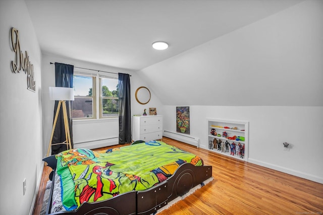 75 Carll Rd, Middletown, CT 06457 - bedroom with baseboard heating, vaulted ceiling, wood finished floors, and baseboards