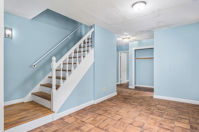 29 Daniels Rd, East Haddam, CT 06423 - stairway featuring a textured ceiling and baseboards
