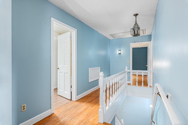 29 Daniels Rd, East Haddam, CT 06423 - hall with an upstairs landing, attic access, light wood-style flooring, and baseboards
