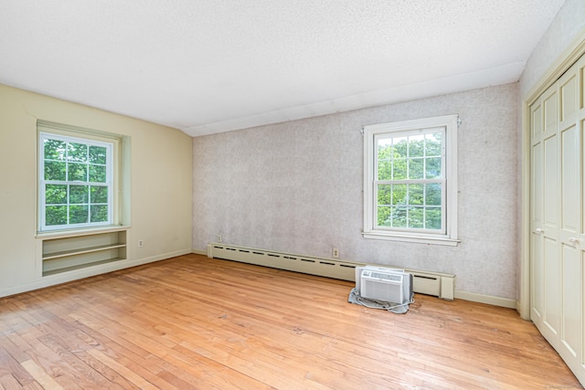 29 Daniels Rd, East Haddam, CT 06423 - unfurnished bedroom featuring light wood finished floors, a baseboard heating unit, and baseboards