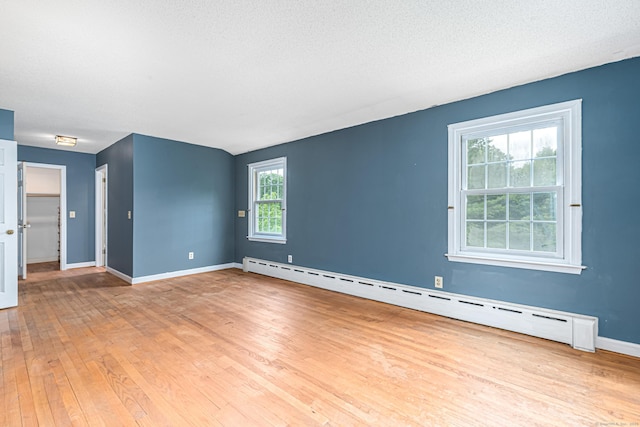 29 Daniels Rd, East Haddam, CT 06423 - empty room with baseboard heating, hardwood / wood-style floors, and baseboards