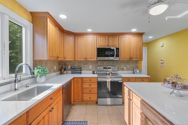 403 Bethmour Rd, Bethany, CT 06524 - kitchen with appliances with stainless steel finishes, a sink, backsplash, a ceiling fan, and light tile patterned flooring
