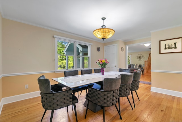 403 Bethmour Rd, Bethany, CT 06524 - dining room with light wood finished floors, ornamental molding, and baseboards
