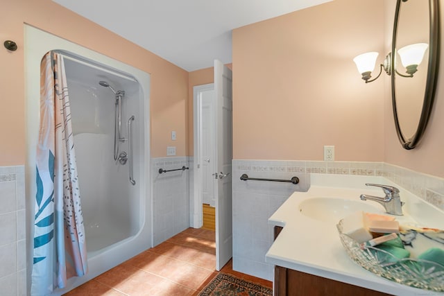 403 Bethmour Rd, Bethany, CT 06524 - bathroom with tile walls, tile patterned floors, vanity, curtained shower, and wainscoting