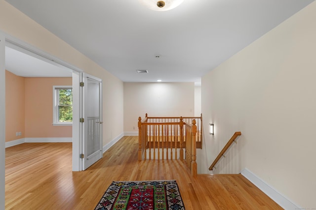 403 Bethmour Rd, Bethany, CT 06524 - hallway featuring an upstairs landing, light wood-style flooring, and baseboards