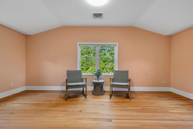 403 Bethmour Rd, Bethany, CT 06524 - living area featuring vaulted ceiling, light wood-style floors, and baseboards
