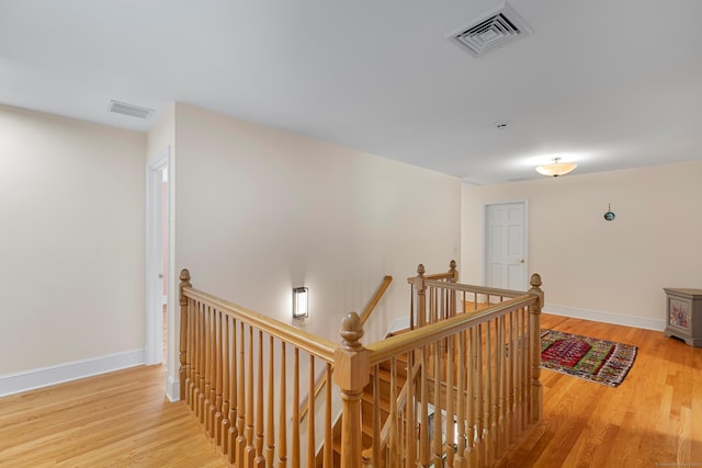 403 Bethmour Rd, Bethany, CT 06524 - corridor with an upstairs landing, wood finished floors, and baseboards