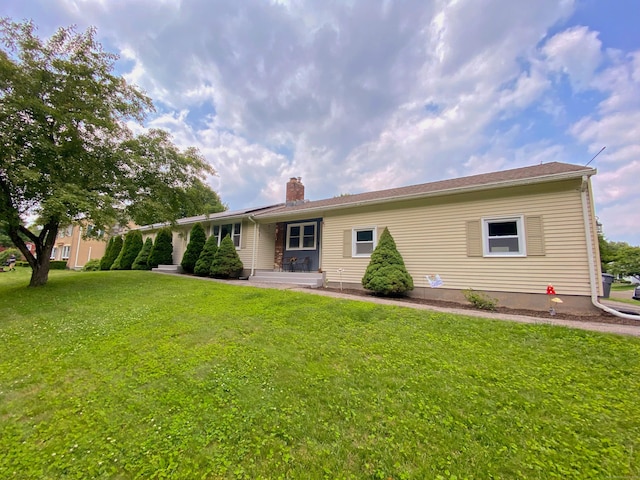 1 Deerfield Rd, Enfield, CT 06010 - back of property with a chimney and a lawn