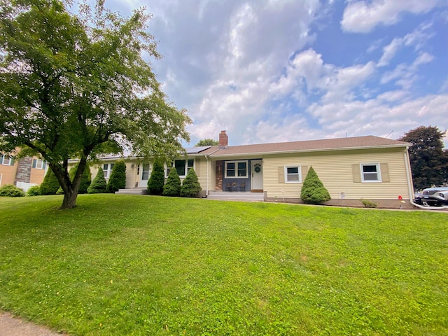 1 Deerfield Rd, Enfield, CT 06010 - single story home with a chimney, a front lawn, and solar panels