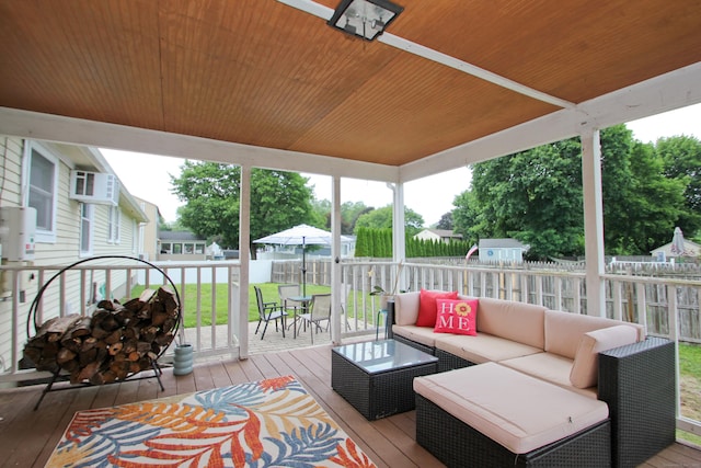 1 Deerfield Rd, Enfield, CT 06010 - wooden terrace with a fenced backyard, outdoor lounge area, and a wall mounted air conditioner