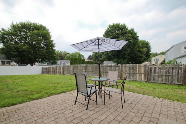 1 Deerfield Rd, Enfield, CT 06010 - fenced backyard with a patio and outdoor dining area