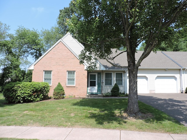 33 Shares Ln Unit 33, South Windsor, CT 06074 - view of front facade featuring an attached garage, brick siding, asphalt driveway, and a front yard