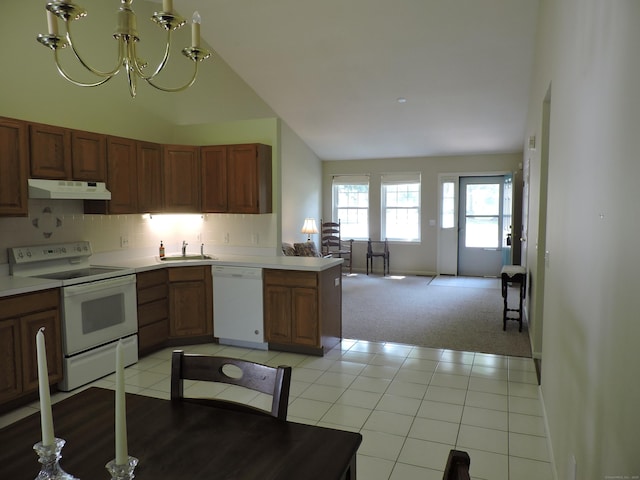 33 Shares Ln Unit 33, South Windsor, CT 06074 - kitchen with white appliances, under cabinet range hood, a chandelier, open floor plan, and light countertops