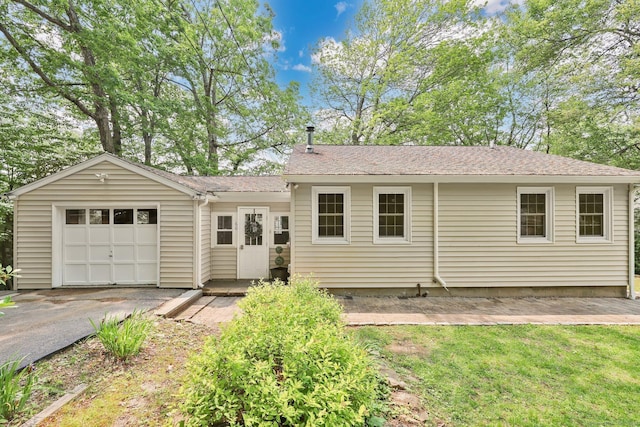 60 Indian Spring Rd, Woodstock, CT 06281 - rear view of house featuring an attached garage and driveway