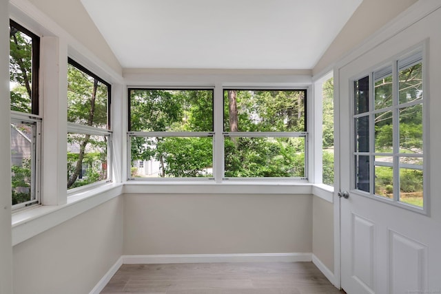 60 Indian Spring Rd, Woodstock, CT 06281 - unfurnished sunroom with lofted ceiling, baseboards, and wood finished floors