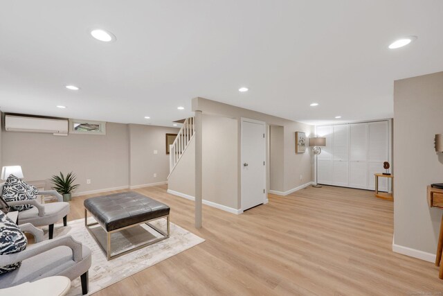 60 Indian Spring Rd, Woodstock, CT 06281 - living area with a wall mounted air conditioner, light wood-style floors, baseboards, and recessed lighting